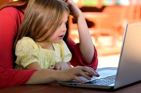 mother and girl with laptop